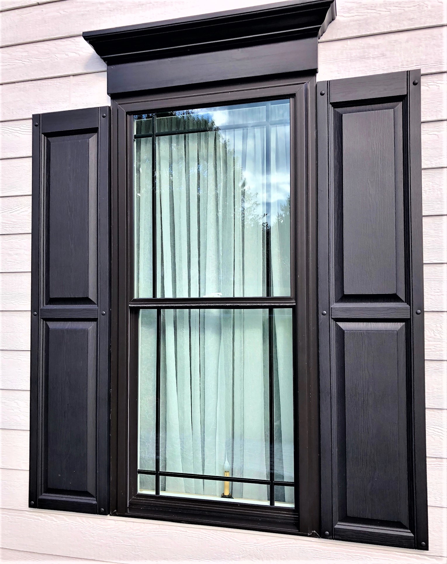 New window with black shutters