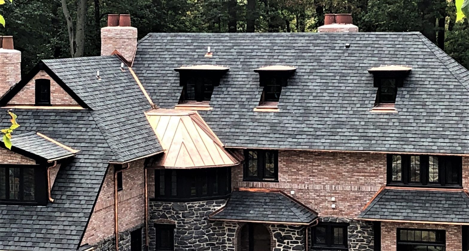 A roof made of shingles and copper