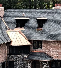 A roof made of shingles and copper