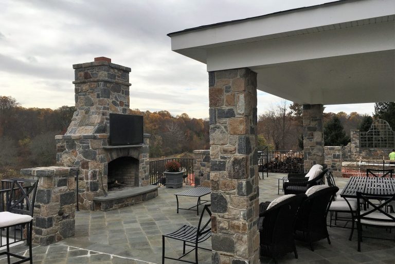 A freshly renovated patio with a large fireplace