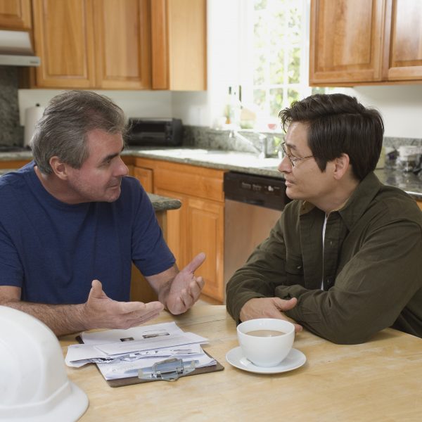 contractor meeting with a homeowner